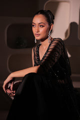 Model wearing a navy blue embellished saree with a detailed blouse, styled for wedding receptions and elegant evening occasions.